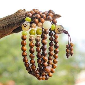A 108 - bead rosewood fozhu string that brings health, rids of troubles, symbolizes wealth and good fortune, balances the body, mind and spirit, and conveys good wishes.